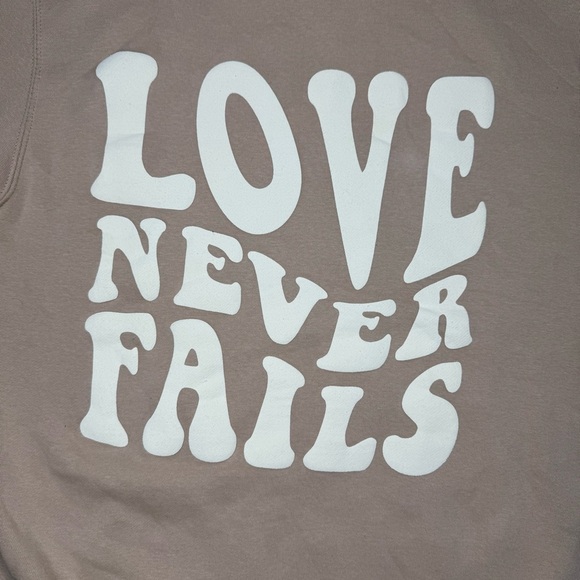 Tan Sweatshirt with 'Love Never Fails' Design Size Medium - Picture 2 of 10